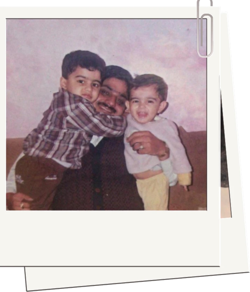 Shrey as a toddler with his father and brother